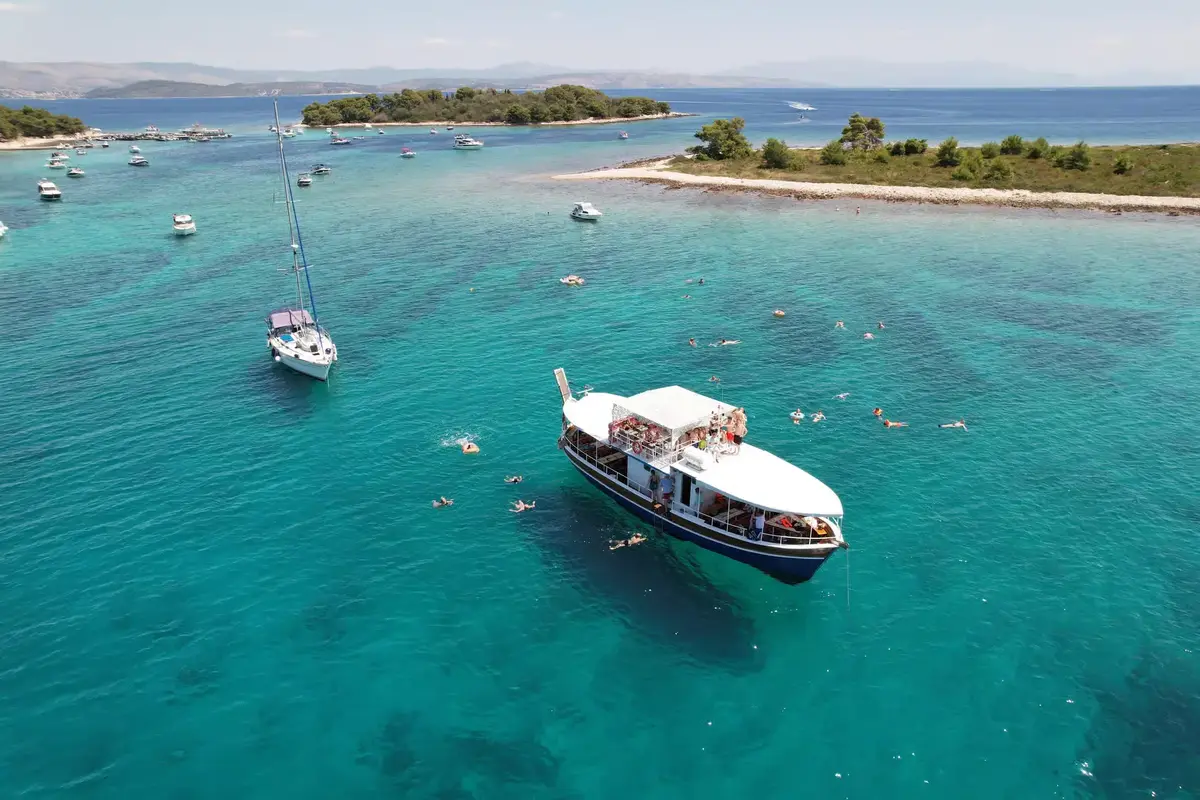 Traditional Dalmatian wooden boat cruising the Adriatic Sea between Split and the Krknjaši islands